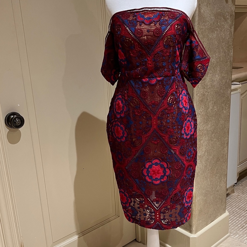 Much more flattering in person and on. Firm fitting shape flattering dress